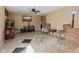 Comfortable living room featuring tile floors, neutral walls, and vintage-style seating arrangements at 1707 W 76Th Pl, Indianapolis, IN 46260