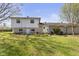 Spacious backyard featuring a two-story home with brick accents and a lush lawn at 1708 Fox Hill Dr, Indianapolis, IN 46228