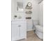 Bathroom featuring a vanity, toilet, and shower with shelves at 1708 Fox Hill Dr, Indianapolis, IN 46228