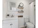 Bathroom with a white vanity, toilet, and a shower with shelves at 1708 Fox Hill Dr, Indianapolis, IN 46228