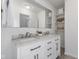Modern bathroom featuring a double sink vanity with a marble countertop and open shelving at 1708 Fox Hill Dr, Indianapolis, IN 46228