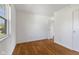 Well-lit bedroom with hardwood floors, a window and a closet at 1708 Fox Hill Dr, Indianapolis, IN 46228