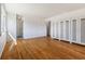 Spacious bedroom features hardwood floors, a window, and ample built-in closet space at 1708 Fox Hill Dr, Indianapolis, IN 46228