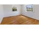 Bedroom with hardwood floors and two windows providing lots of natural light at 1708 Fox Hill Dr, Indianapolis, IN 46228