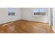 Bright bedroom with hardwood floors and two windows offering plenty of natural light at 1708 Fox Hill Dr, Indianapolis, IN 46228