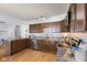 Well-appointed kitchen with granite countertops, wood cabinets and stainless steel appliances at 1708 Fox Hill Dr, Indianapolis, IN 46228