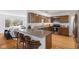 Modern kitchen features granite countertops, a breakfast bar, and stainless steel appliances at 1708 Fox Hill Dr, Indianapolis, IN 46228