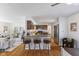 Open concept kitchen features a breakfast bar and stainless steel appliances at 1708 Fox Hill Dr, Indianapolis, IN 46228