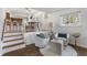 Bright living room showcasing armchairs, decorative accents, and hardwood flooring at 1708 Fox Hill Dr, Indianapolis, IN 46228
