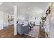 Open-concept living space featuring hardwood floors, comfortable seating, and abundant natural light at 1708 Fox Hill Dr, Indianapolis, IN 46228