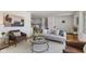 Bright living room featuring modern decor, hardwood floors, and cozy seating at 1708 Fox Hill Dr, Indianapolis, IN 46228