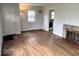 Bright and spacious living room featuring a decorative fireplace and beautiful hardwood floors at 2120 Sheffield Ave, Anderson, IN 46011