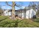 A charming backyard features a pergola with outdoor seating and a well-maintained lawn at 2221 Groff Ave, Indianapolis, IN 46222