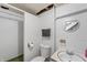 Basement bathroom featuring white-painted block walls and older vanity at 2221 Groff Ave, Indianapolis, IN 46222