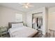Comfortable bedroom offering neutral tones, ample natural light, and a spacious closet at 2221 Groff Ave, Indianapolis, IN 46222