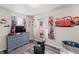 Cozy bedroom featuring character-themed décor, gray dresser, and a comfortable chair at 2221 Groff Ave, Indianapolis, IN 46222