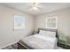Serene bedroom with natural light, laminate floors, and simple yet elegant furnishings at 2221 Groff Ave, Indianapolis, IN 46222