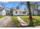 Charming single-story home with a brick walkway, mature trees, and well-maintained lawn at 2221 Groff Ave, Indianapolis, IN 46222