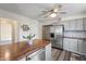 Updated kitchen showcasing stainless steel appliances, butcher block countertops, and gray cabinetry at 2221 Groff Ave, Indianapolis, IN 46222