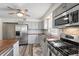 Beautiful kitchen featuring stainless steel appliances, butcher block countertops, and modern fixtures at 2221 Groff Ave, Indianapolis, IN 46222