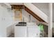 Basement laundry room featuring a modern washer and dryer with open ceiling at 2221 Groff Ave, Indianapolis, IN 46222