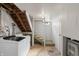 Basement laundry room featuring a modern washer and dryer with stairs to the side at 2221 Groff Ave, Indianapolis, IN 46222