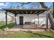 Outdoor patio with wicker seating and a covered structure, perfect for backyard entertaining at 2221 Groff Ave, Indianapolis, IN 46222