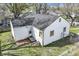 An aerial view of the back of a home, highlighting a brick patio and updated roof at 2221 Groff Ave, Indianapolis, IN 46222