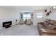 Spacious basement featuring a modern fireplace, leather seating, and a 'Personal Cave' sign at 2538 Redding Dr, Whitestown, IN 46075