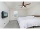 Modern bedroom with a ceiling fan and a wall-mounted television at 2538 Redding Dr, Whitestown, IN 46075