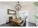 Dining room with a modern chandelier, table set for four, and stylish decor at 2538 Redding Dr, Whitestown, IN 46075