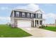 Beautiful two-story home with a two car garage, covered porch, and landscaped yard at 2538 Redding Dr, Whitestown, IN 46075