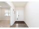Inviting foyer features a light colored door and wood floors at 2538 Redding Dr, Whitestown, IN 46075