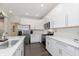 Well-lit kitchen featuring stainless steel appliances, white cabinets, and stylish countertops at 2538 Redding Dr, Whitestown, IN 46075