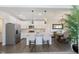 Open-concept kitchen featuring white cabinets, a center island, and stainless steel appliances at 2538 Redding Dr, Whitestown, IN 46075