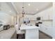 Beautiful kitchen with white cabinetry, stainless steel appliances, a center island, and hardwood flooring at 2538 Redding Dr, Whitestown, IN 46075