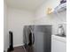 Efficient laundry room with modern washer and dryer units and storage shelving at 2538 Redding Dr, Whitestown, IN 46075