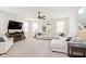 Bright living room with a fireplace, large sectional sofa, and plenty of natural light at 2538 Redding Dr, Whitestown, IN 46075