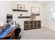 Well-lit office space with a wooden desk, decor, and a large window at 2538 Redding Dr, Whitestown, IN 46075