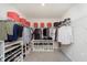 Organized walk-in closet with shelves, hanging rods, and shoe racks at 2538 Redding Dr, Whitestown, IN 46075