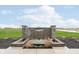 Tranquil water feature enhancing the outdoor space, made with stone and lovely landscaping at 2538 Redding Dr, Whitestown, IN 46075