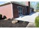 Well-maintained backyard with brick house, patio, and neatly mulched flowerbeds ready for planting at 2692 E County Road 750 S, Clayton, IN 46118