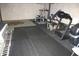 Spacious home gym in basement with exercise equipment and rubber flooring at 2692 E County Road 750 S, Clayton, IN 46118