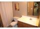 Cozy bathroom featuring a wood vanity, white countertop, and decorative shower curtain at 2692 E County Road 750 S, Clayton, IN 46118