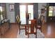 Formal dining room with hardwood floors and a table set for six, and lots of natural light at 2692 E County Road 750 S, Clayton, IN 46118