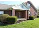 Charming brick home with lush landscaping, complemented by a quaint covered front porch at 2692 E County Road 750 S, Clayton, IN 46118