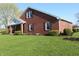 Well-maintained brick home with lush green lawn, showcasing classic architecture and curb appeal at 2692 E County Road 750 S, Clayton, IN 46118