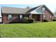 Beautiful brick home with a well-maintained lawn and shutters, showcasing classic curb appeal at 2692 E County Road 750 S, Clayton, IN 46118