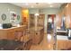 Spacious kitchen with hardwood floors, an island with seating, and lots of natural light at 2692 E County Road 750 S, Clayton, IN 46118
