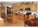 Kitchen with stainless steel appliances, tile backsplash, and eat in dining area at 2692 E County Road 750 S, Clayton, IN 46118